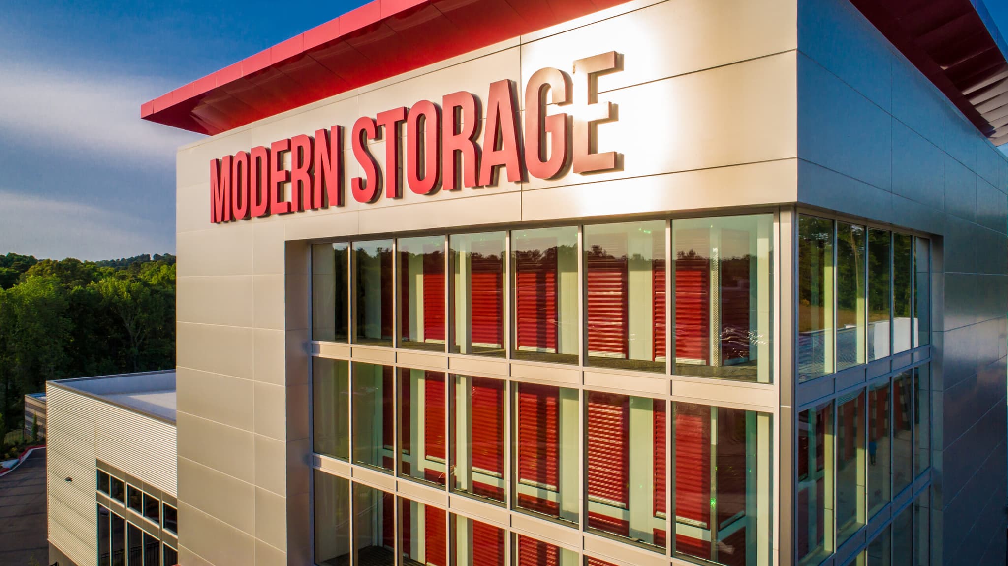 Modern Storage® West Little Rock facility exterior with red trim and large windows